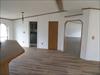 Entrance to Living Room, closet and entrance to utility room