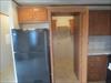 Kitchen.  The cabinets open and lead to the laundry room. 