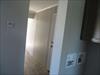Washer dryer area and rear door.  
